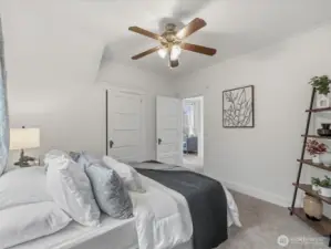 The main level primary bedroom. This room could also be a perfect family room if desired.