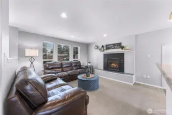 Large windows in the living room let in tons of natural light