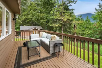 expansive deck leading you out back with views of Mt. Si