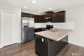 Pantry to the left of the refrigerator