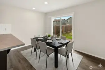 Virtually staged photo of dining area.