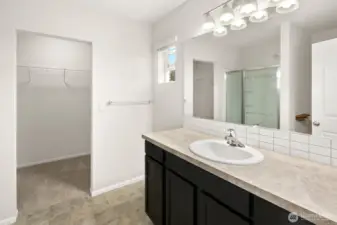 Primary bath has a large walk in closet