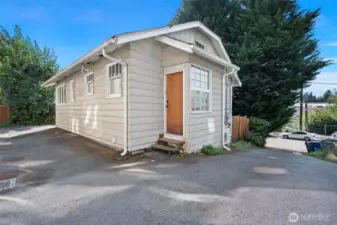 Backdoor entrance leads to stairs.