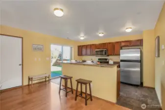 Eating peninsula along with dining room.