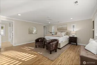 Primary room/bonus room featuring large ensuite bathroom and walk in closet