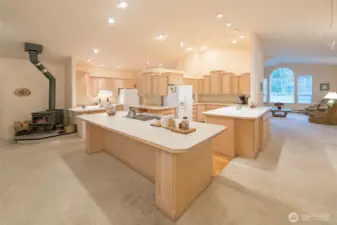 Huge kitchen with two ovens, full size freezer, breakfast nook, two sinks, and so much storage.