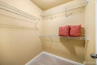 Walk-in closet located off the primary bath