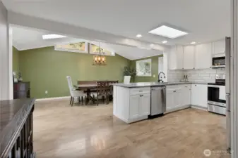 From vaulted ceilings in the dining room to Transom windows, skylights and an abundance of windows offering lots of natural light and a cheery vibe throughout!