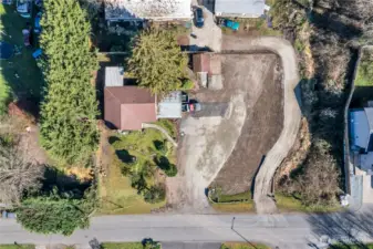The current home is located on the far west side of the lot so there is plenty of room to add additional structures! (Buyer to verify). There is a 30 foot recorded easement on east side and is attached in the MLS documents. The current road is west of that.