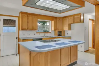 Nice tile accents for the back splash, garden window and door to the covered area in the back.