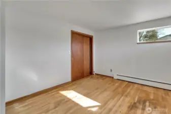 Here is the front bedroom and there is an adjacent 1/5 bathroom.