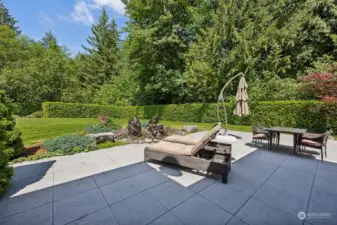 Sit down and relax a while, thanks to the built in irrigation systems in both the front and back of this home for the flower beds, keeping the pretty landscaping watered and happy year-round.