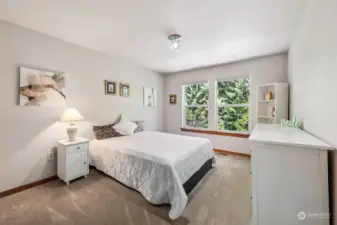 Bedroom number two, with pretty treetop views out of the double windows. This home is located in Olympia School District, with kids having the option to attend McLane Elementary, Marshall Middle and Capital or Avanti High Schools.