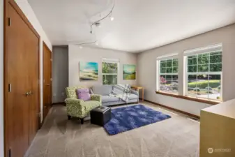 The upstairs loft boasts double French door closets and space to spread out for fun or relaxation, an excellent opportunity for a second gathering space for homes with multigenerational living.