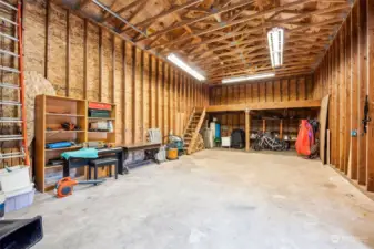Pull in RV or boat for winter storage in this amazing the 40’ x 20’ garage, with 12’ ceilings complete with upper loft storage level in this well-lit building.