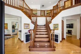 Imagine all of the dramatic ascensions on this stunning staircase! The front door opens to this impressive foyer, with rich maple hardwood flooring flowing through casual and formal spaces.