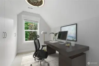 Efficient Tech Nook with a wall of built-in cabinets for all your office and storage needs. Cabinets installed in 2022.  This room is virtually staged.