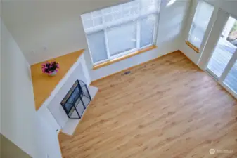 Looking down to living room from upper loft area