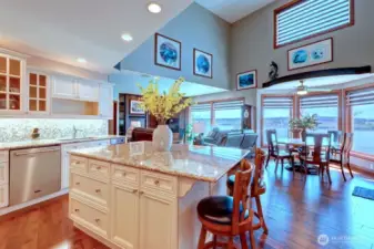 Spacious kitchen off den enjoys water & mountain views while you prepare meals.  .