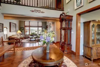 Spacious foyer looking opens up to formal living room overlooking Mt. Rainier, Puget Sound and Chambers Bay Golf Course.