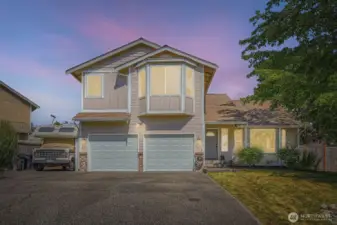 Stunning Twilight Curb Appeal  Experience your home’s enchanting charm as it glows softly at twilight, welcoming you with warm, inviting light and captivating presence.