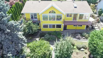 View of back oh home and back yard,  additional parking down below.