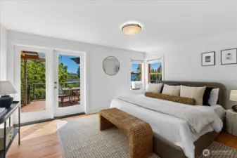 Primary Bedroom with new French Doors that access the back deck and allow more Southern light in.