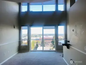 living room with floor to ceiling windows