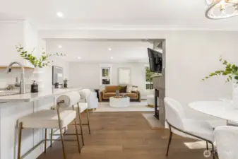 The open layout seamlessly connects kitchen, dining, and living areas for effortless entertaining.