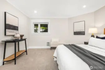 Enjoy multiple layout options in this relaxing primary suite, highlighted by fresh paint, modern lighting, and a serene palette.