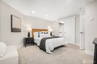 This primary suite features a walk-in closet with built-in California Closet organizers and a stunning ensuite bathroom, creating the ultimate private retreat.