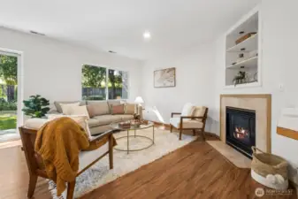 The spacious open concept living area with cozy gas fireplace. The perfect spot to entertain.