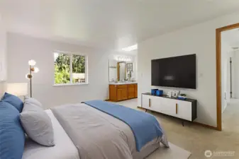 Spacious virtually staged primary suite with 3/4 bath.