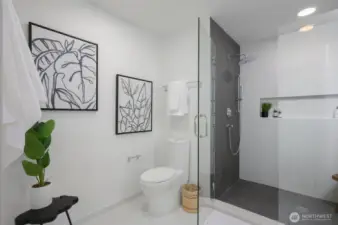 Bathroom features a ceramic tile walk-in shower and a floating quartz vanity with a daylight mirror.