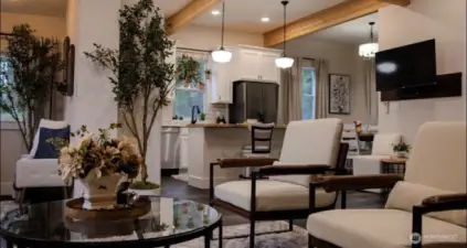 Well lit living room much larger then it appears