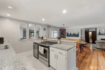 Bright and refreshed kitchen featuring stainless steel appliances, granite countertops, ample cabinet storage, and modern finishes.