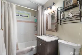 Full Bathroom -   Full bath with tub/shower combo, updated vanity, and classic clean design.