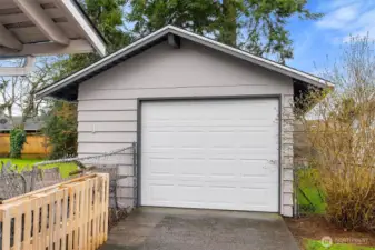 Detached one-car garage offers added parking, storage, workspace potential, or room for hobbies.