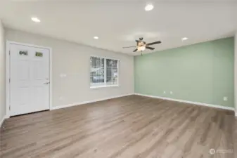 Living room looking toward front window and entry.