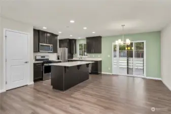 Walk-in pantry and a nice open eating area that leads outside to the deck.  Perfect for indoor/outdoor living and entertaining.