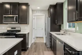 Laundry room is through the door shown here and beyond that, the garage. Very convenient for bringing in groceries.