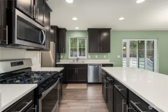 Lots of cabinet space here and the kitchen overlooks the backyard, making it easy to keep an eye on littles or pets playing in the yard.