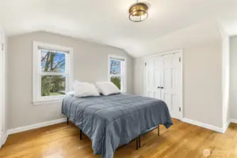 One of three upper level bedrooms. Bright and spacious with double closets.