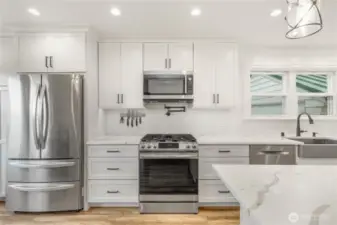 Fully updated kitchen also includes a gas range, recessed lighting and plenty of storage and work space.