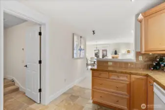 Access to the in-unit laundry and garage off to the left.