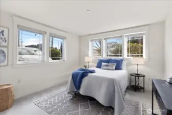 Sunny and bright Primary bedroom.