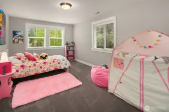 Corner bedroom is full of fun and light