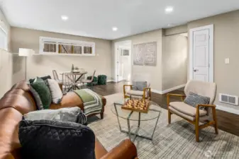 Lower level living room, showing access to the small lower level bedroom.