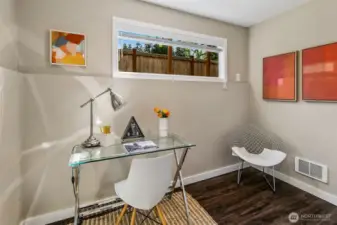 Lower level bedroom, staged as an office.
