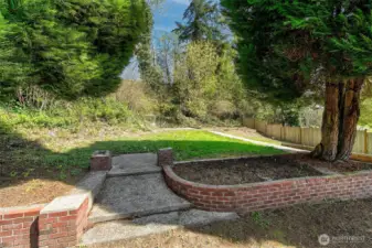 Extra space beyond the fenced backyard.